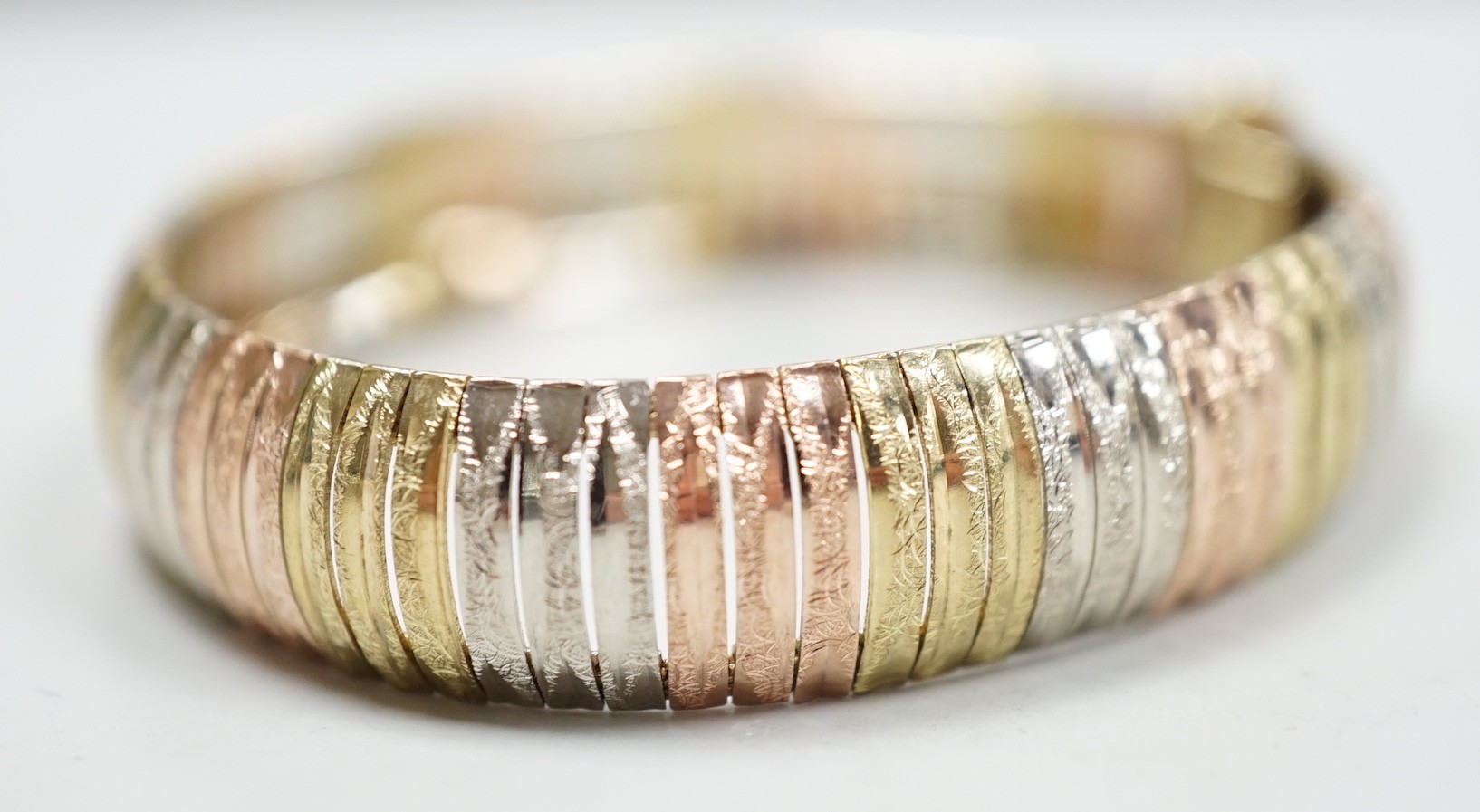 A modern Italian three colour 9ct gold bracelet, 18cm, 18 grams.